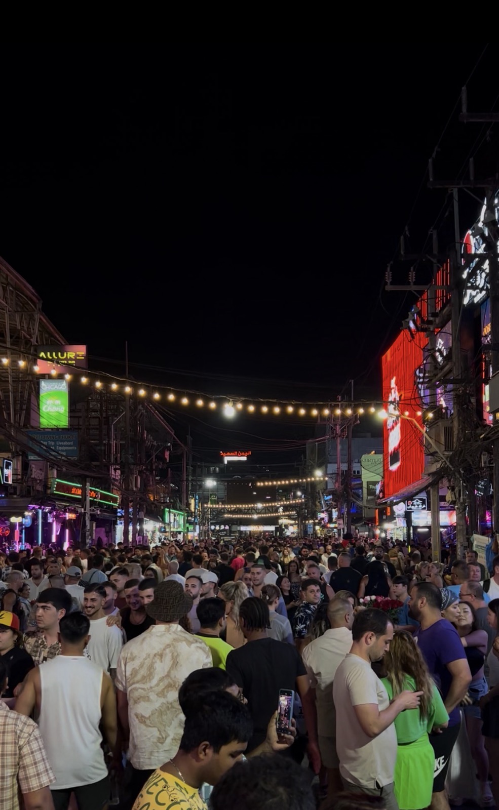 Crowds and neon signs on Bangla Road, Patong, at night