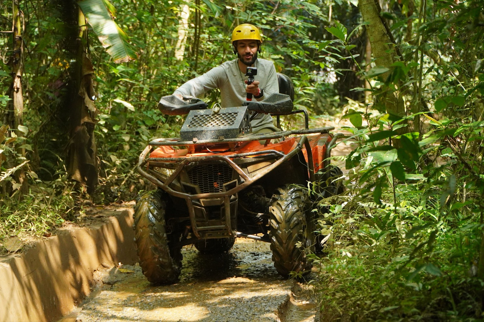ATV riding through a muddy jungle trail, Phuket
