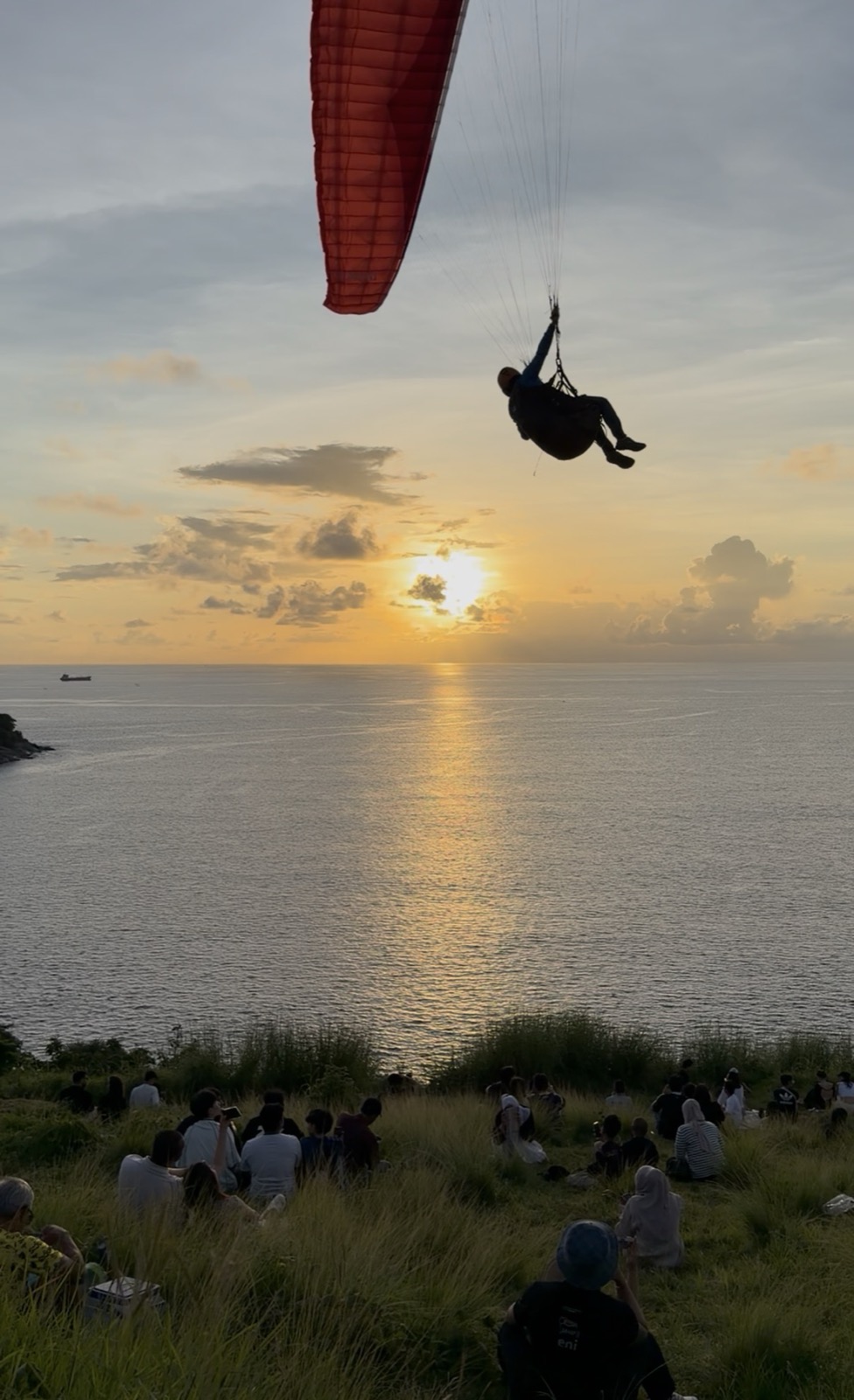 Paragliding at sunset from Windmill Viewpoint, Phuket