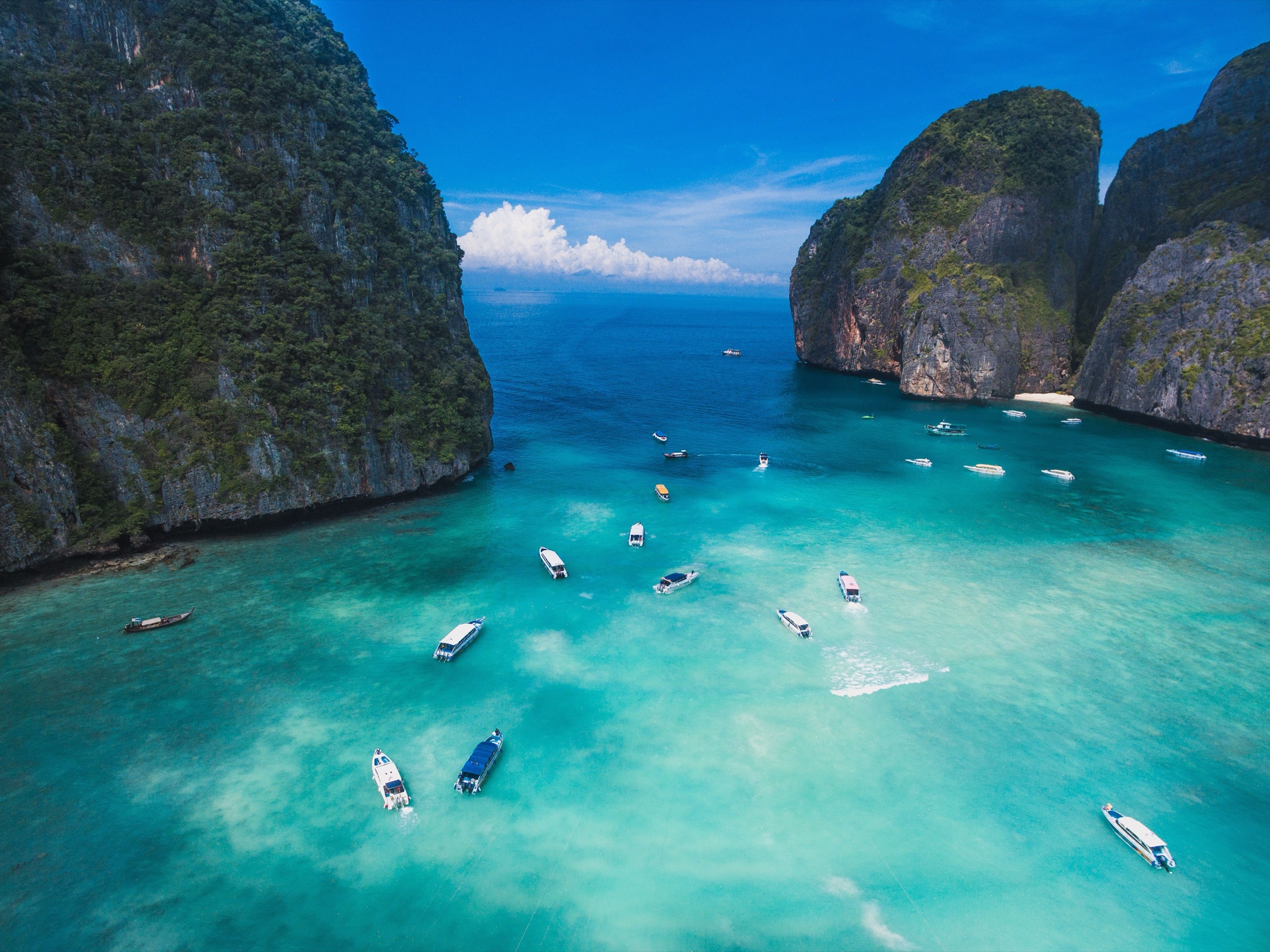 Aerial view of a turquoise lagoon between limestone cliffs, Phi Phi Islands