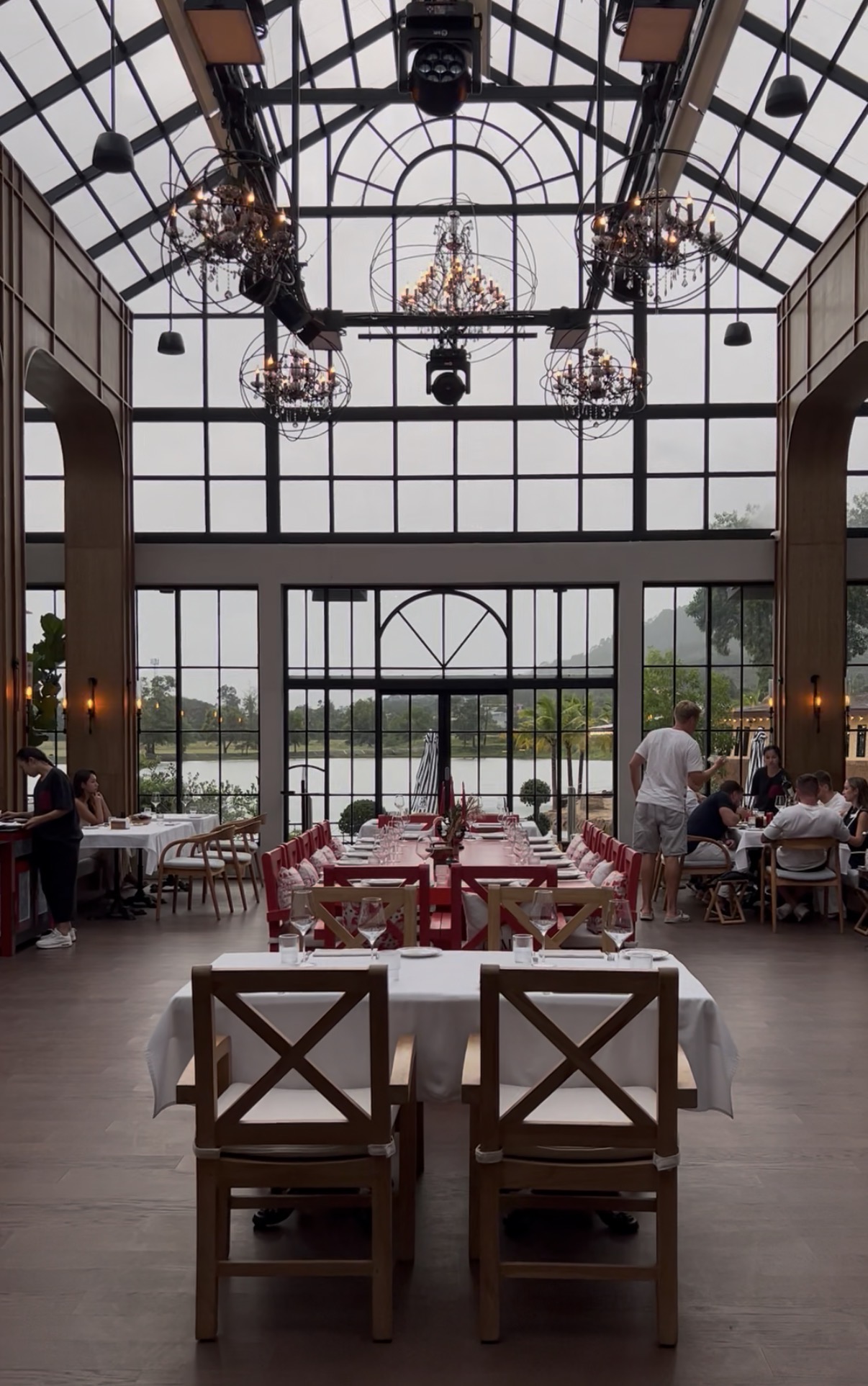 Etna restaurant dining room with glass roof and lakeside terrace, Bang Tao