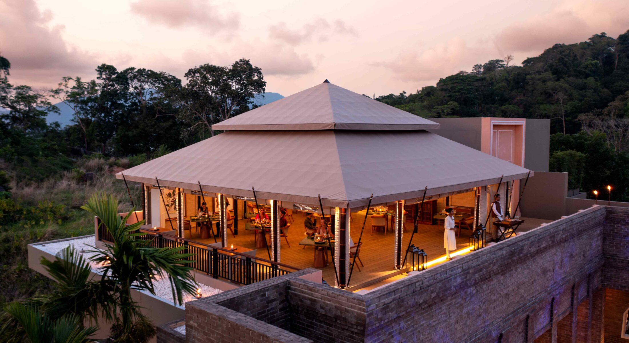 Tambu restaurant rooftop tented dining pavilion at Avista Hideaway Patong at dusk