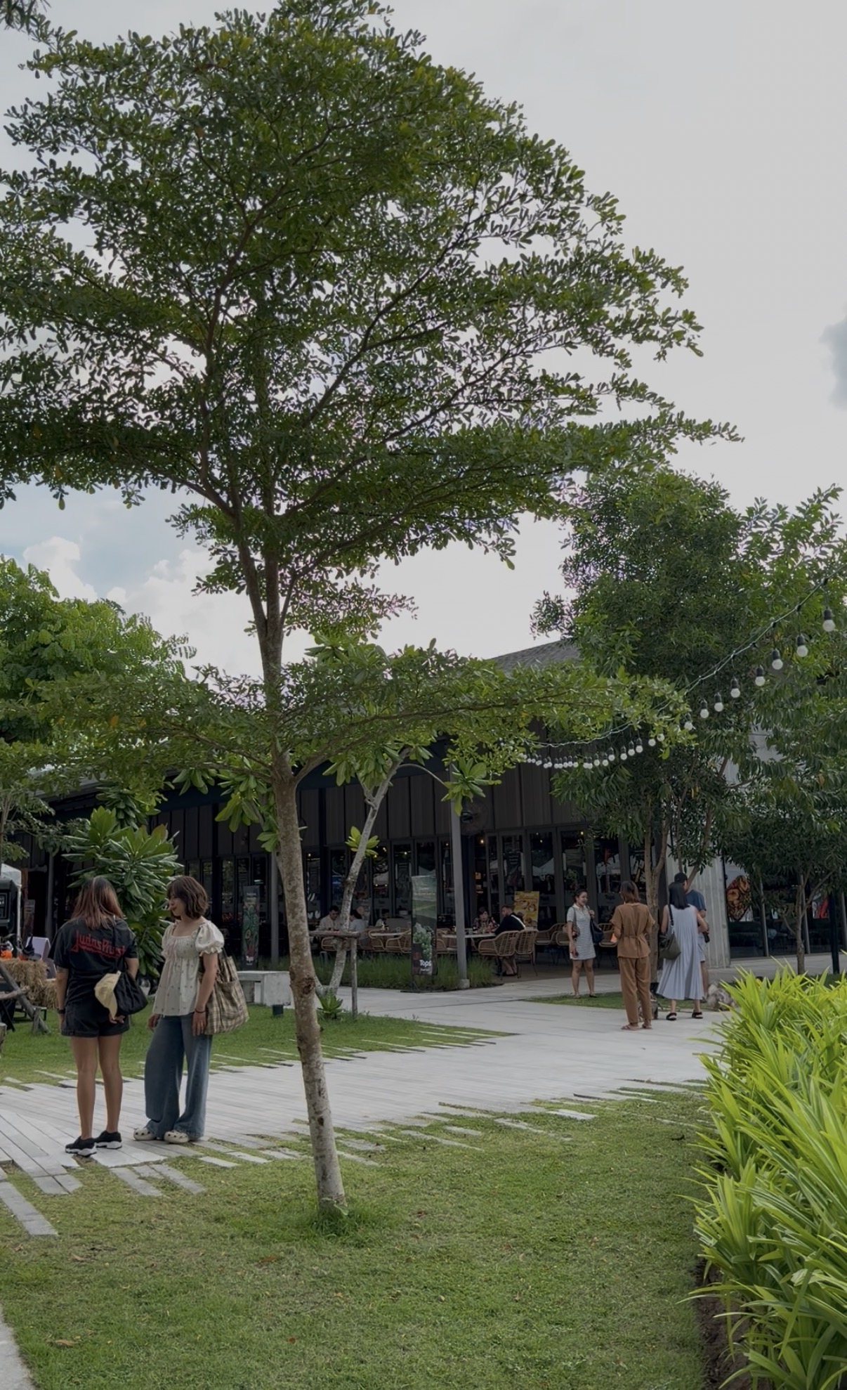 Open-air garden dining area at Porto de Phuket, Bang Tao